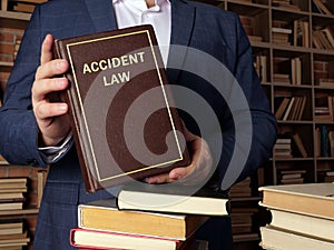 Attorney holds ACCIDENT LAW book. CarÂ accident lawÂ refers to theÂ legalÂ rules that determine who is responsible for the